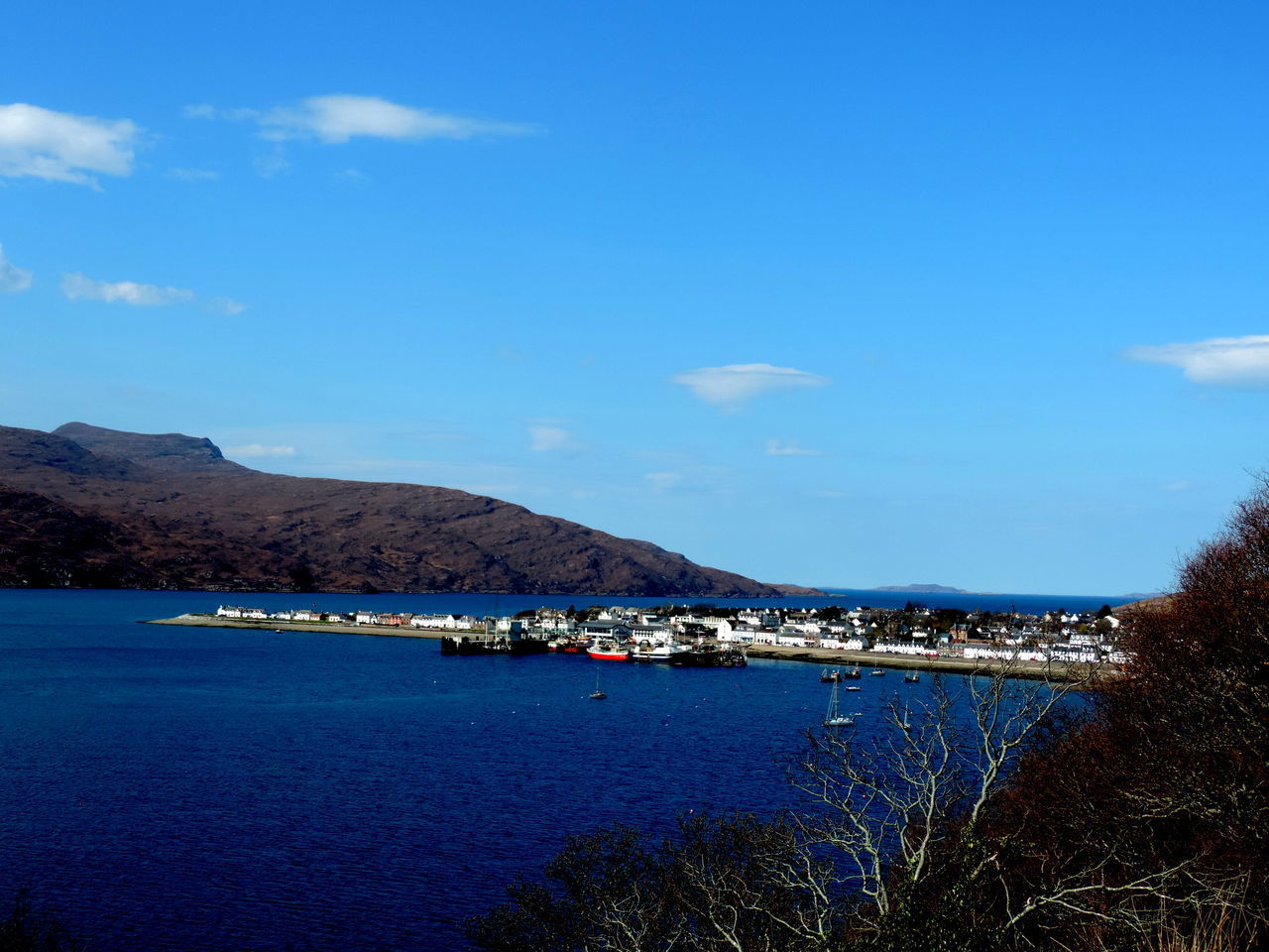 SCENIC VIEW OF BAY AGAINST SKY