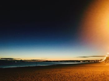 Scenic view of beach against clear sky