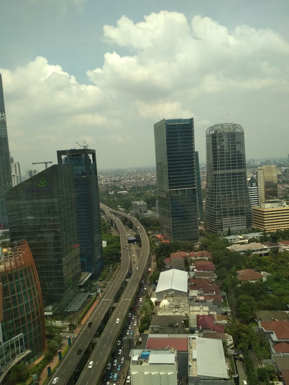 HIGH ANGLE VIEW OF STREET AMIDST BUILDINGS IN CITY