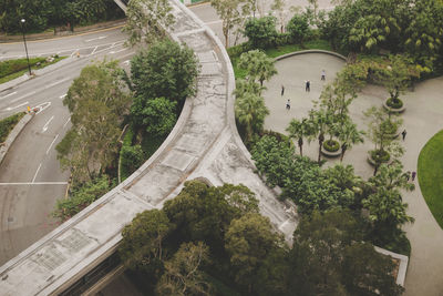 High angle view of road amidst trees in city