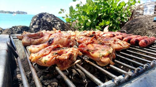 Close-up of chicken meat on barbecue grill