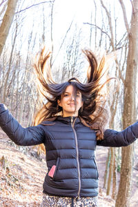 Portrait of a girl in the forest in winter