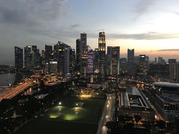 High angle view of illuminated city buildings against sky