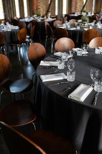 Empty chairs and tables in restaurant