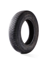Close-up of tire against white background