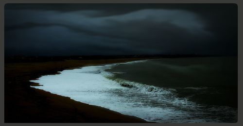 Scenic view of sea against cloudy sky