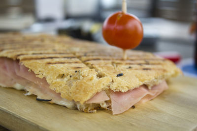 Ham and cheese mixed toast on a wooden board