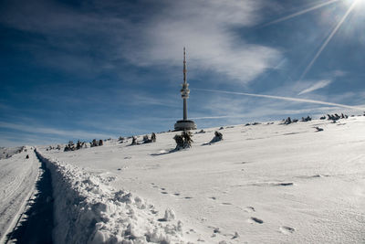 Scenic view of snow covered mountains against sky