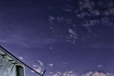 Low angle view of building against sky at night