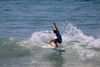 Man jumping in sea