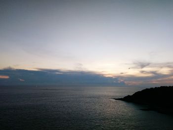 Scenic view of sea against sky at sunset