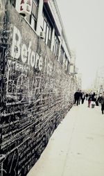 Woman standing in front of building