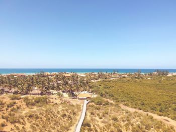 Panoramic view of beach against blue sky