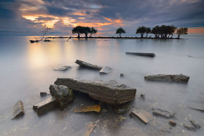 Scenic view of sea against cloudy sky