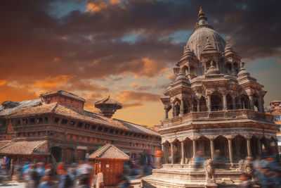 Low angle view of temple against cloudy sky