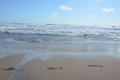 Scenic view of beach against sky