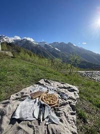 View of corn on field against mountain range