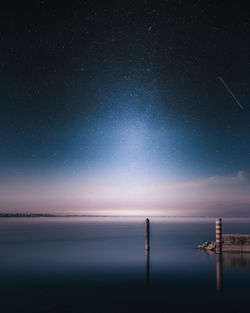Scenic view of sea against sky at night
