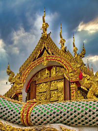 Low angle view of ornate building against sky