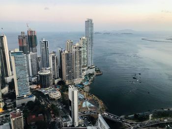 High angle view of buildings in city against sky