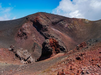 View of volcanic landscape against cloudy sky