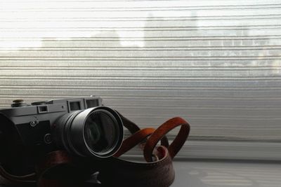 Close-up of camera on wall