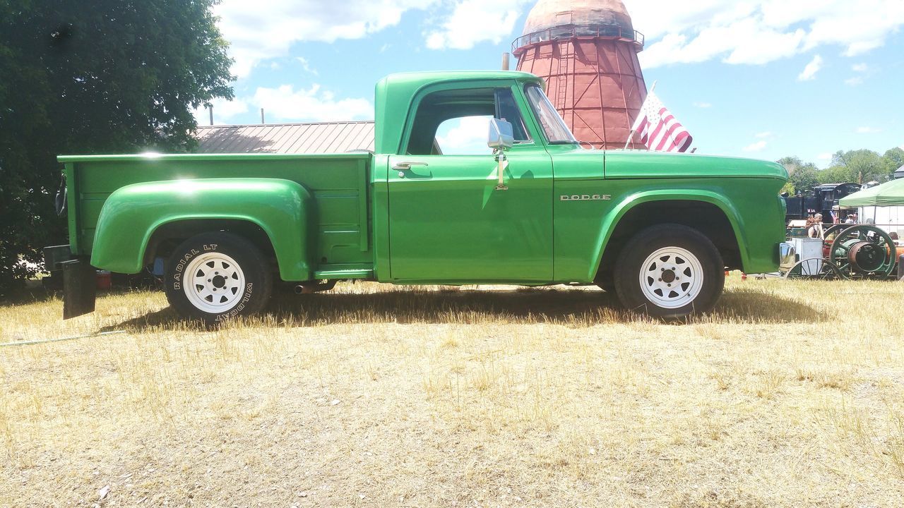 VINTAGE TOY CAR ON FIELD