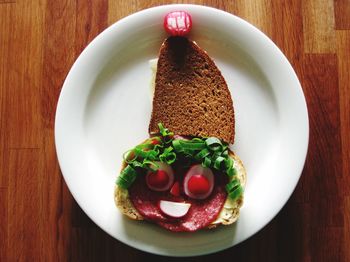 Plate with sandwich on table