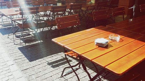 High angle view of empty chairs and table in restaurant