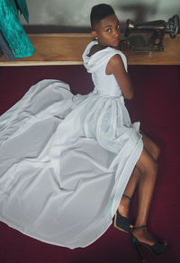 High angle view of woman sitting at home