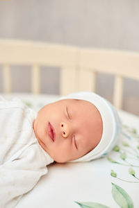 Cute baby sleeping in crib