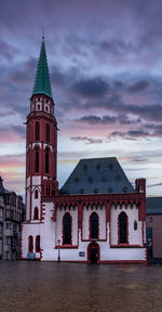 View of building against cloudy sky