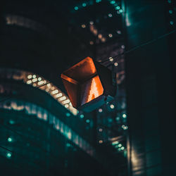 Low angle view of illuminated stoplight