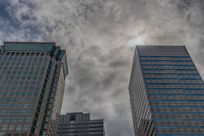 Low angle view of modern buildings against sky