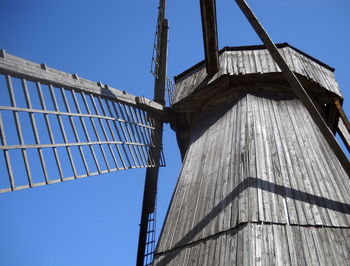 Low angle view of building against clear blue sky