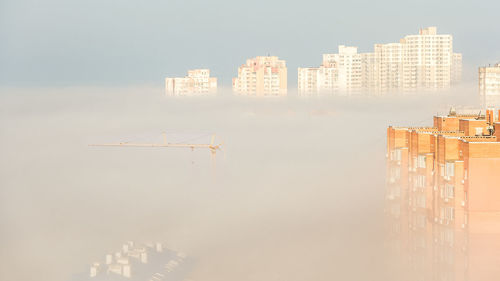 Modern buildings in city against sky