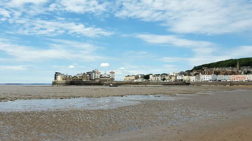 Scenic view of beach against sky during low tide