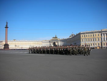 People on street against clear sky