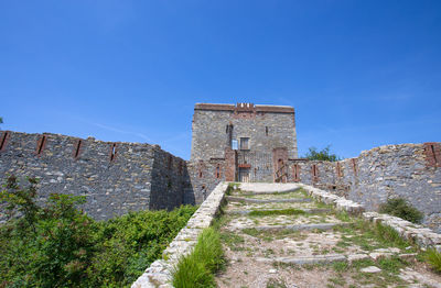 View of historic building against blue sky