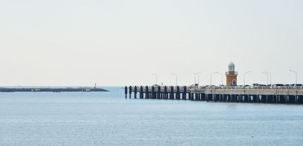 Pier over sea against clear sky