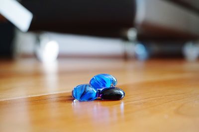 Close-up of marbles on wooden table