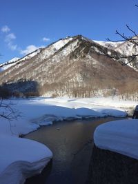 Scenic view of frozen landscape against sky