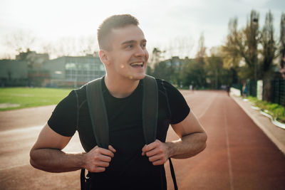 Portrait of young man standing outdoors