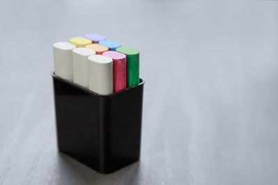 Close-up of multi colored pencils on table