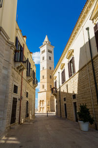 Low angle view of buildings against blue sky