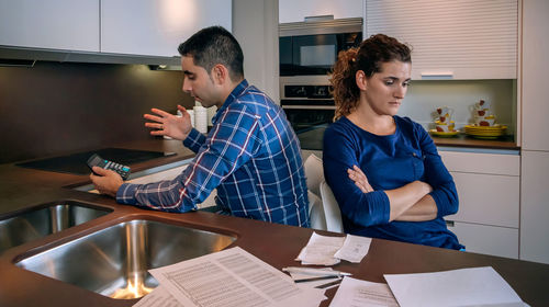 Young couple sitting on table