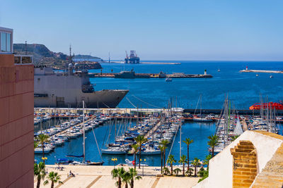 Boats moored at harbor