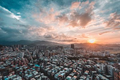 Cityscape against sky during sunset