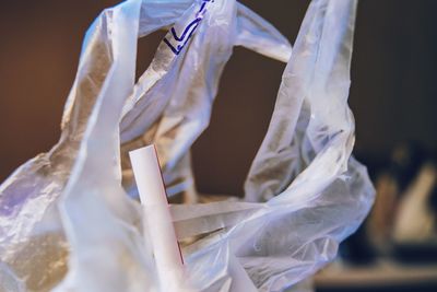 Midsection of woman holding white paper