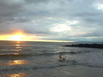 Scenic view of sea against sky during sunset